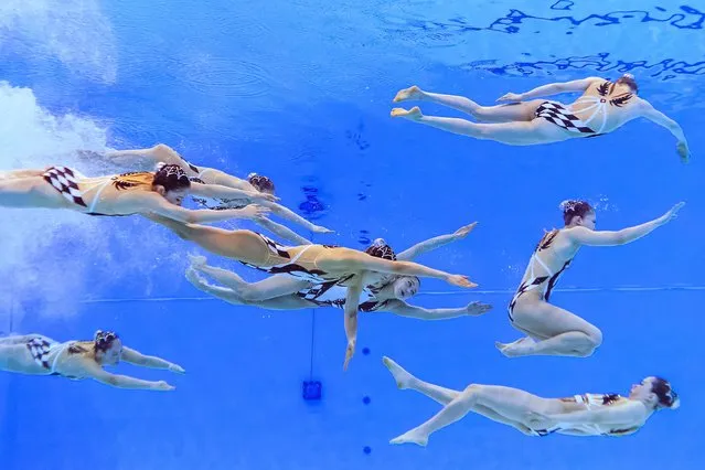 Team Japan competes in the preliminary round of the team free artistic swimming event during the 2024 World Aquatics Championships at Aspire Dome in Doha on February 8, 2024. (Photo by Manan Vatsyayana/AFP Photo)