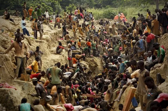 Prospectors search for gold at a gold mine near the village of Gamina, in western Ivory Coast, March 18, 2015. (Photo by Luc Gnago/Reuters)