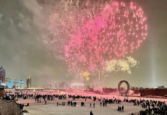 Fireworks light up the sky during the new year celebrations in Astana, Kazakhstan on January 01, 2022. (Photo by Meiramgul Kussainova/Anadolu Agency via Getty Images)