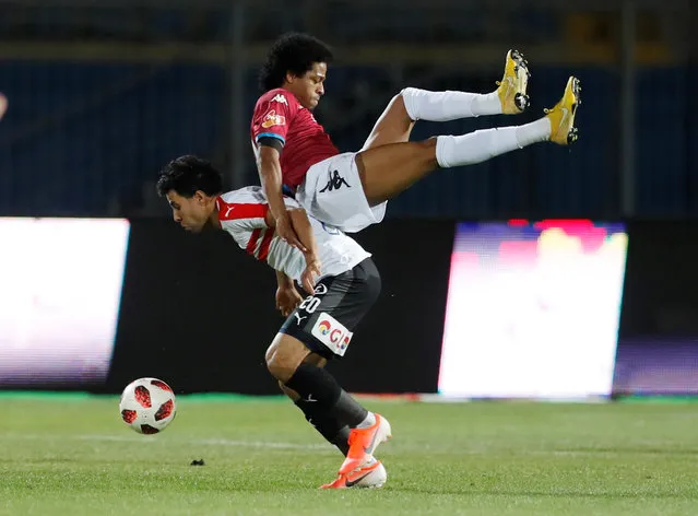 Zamalek's Mohamed Ibrahim in action with Pyramids' Keno during the match of the Egyptian Premier League between Pyramids FC and Zamalek at the 30 June Air Defense Stadium in Cairo, Egypt on April 23, 2019. (Photo by Amr Abdallah Dalsh/Reuters)