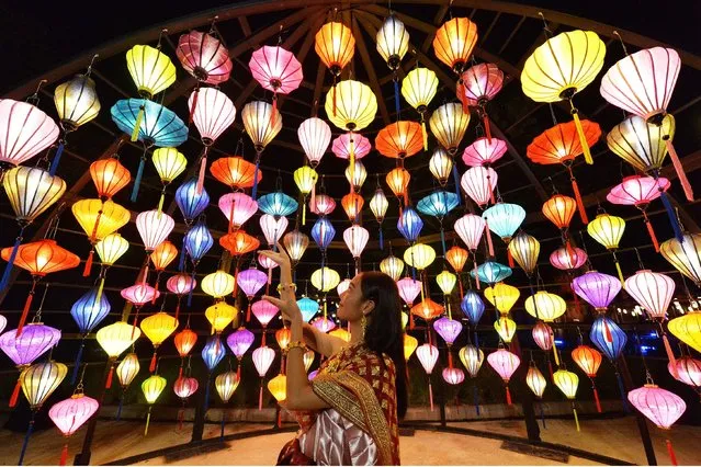 People visit a pre-show of the Thailand International Lantern and Food Festival at Muangboran, Samut Prakan Province, Thailand, on November 8, 2021. The festival will be held from Nov. 12 to Dec. 6. (Photo by Xinhua News Agency/Rex Features/Shutterstock)