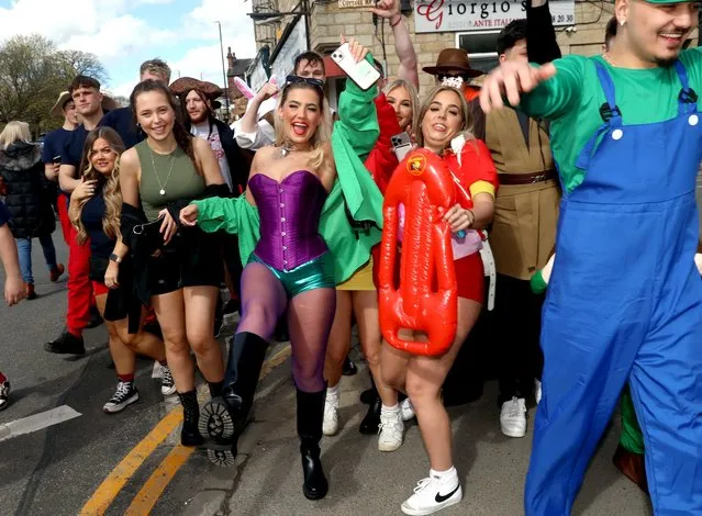 Boozed-out revellers donned fancy dress as they welcomed in the Bank Holiday at the Otley Run. Hundreds swarmed Leeds, UK on Saturday, March 30, 2024, as the infamous tipple mission got underway beneath blue skies and sunshine. (Photo by NB Press LTD)
