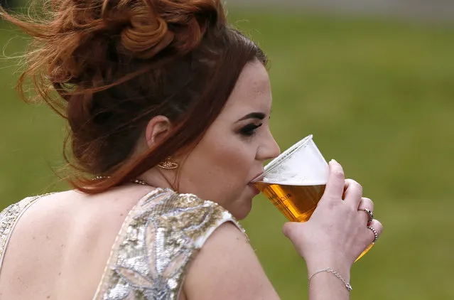 Horse Racing, Crabbie's Grand National Festival, Aintree Racecourse on April 7, 2016: General view of a racegoer having a drink. (Photo by Jason Cairnduff/Reuters/Action Images/Livepic)