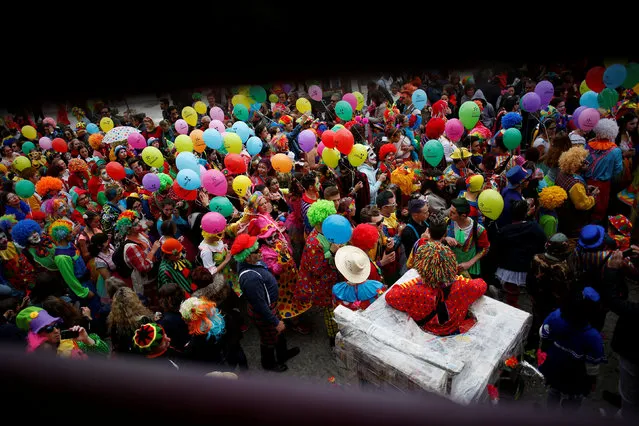 Carnival revellers participate in the clowns parade in Sesimbra village, Portugal, February 27, 2017. (Photo by Pedro Nunes/Reuters)