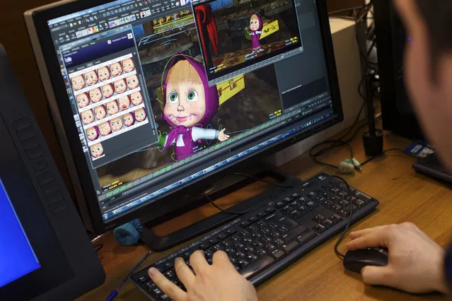 In this Wednesday, March 2, 2016 photo, senior animator Andrei Belyayev works a on new episode of the Masha and the Bear cartoon series in Moscow, Russia. Masha and the Bear, a Russian animated television series launched in 2009, now broadcasts in more than 120 countries including the United States. Its YouTube channel is in the top 10 most-viewed worldwide. (Photo by Ivan Sekretarev/AP Photo)