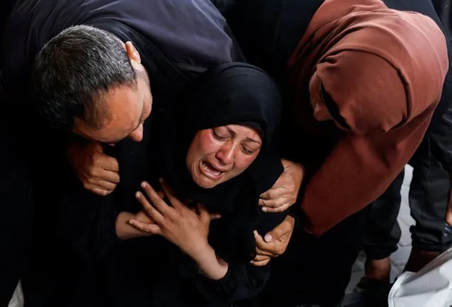A woman reacts next to the bodies of Palestinians (not pictured) killed in Israeli strikes, amid the ongoing conflict between Israel and the Palestinian Islamist group Hamas, in Rafah, in the southern Gaza Strip on April 16, 2024. (Photo by Mohammed Salem/Reuters)