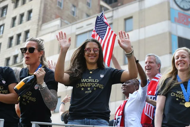 Alex Morgan acknowledges the crowds as the U.S. women's soccer team is celebrated with a parade along the Canyon of Heroes, Wednesday, July 10, 2019, in New York. (Photo by Gordon Donovan/Yahoo News)