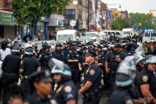 New York Police Department officers stand guard as Pro-Palestinian protestors demonstrate, amid the ongoing conflict between Israel and the Palestinian Islamist group Hamas, in the Brooklyn borough of New York City, on May 18, 2024. (Photo by Eduardo Munoz/Reuters)
