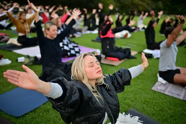 Guests take part in a mass meditation class to celebrate World Meditation Day, at the Royal Botanic Gardens, in Sydney, Friday, May 21, 2021. (Photo by Joel Carrett/AAP Image)