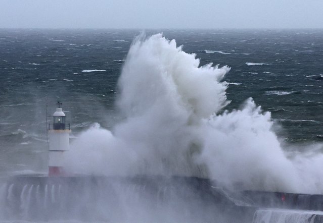 Large waves crash over the harbour wall as Storm Nelson arrives at Newhaven, Britain on March 28, 2024. (Photo by Toby Melville/Reuters)