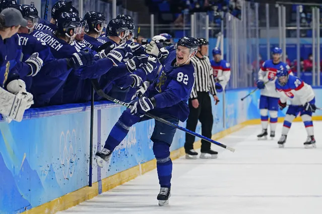 Finland's Harri Pesonen (82) celebrates after scoring a goal against Slovakia during a men's semifinal hockey game at the 2022 Winter Olympics, Friday, Feb. 18, 2022, in Beijing. Finland won 2-0. (Photo by Matt Slocum/AP Photo)