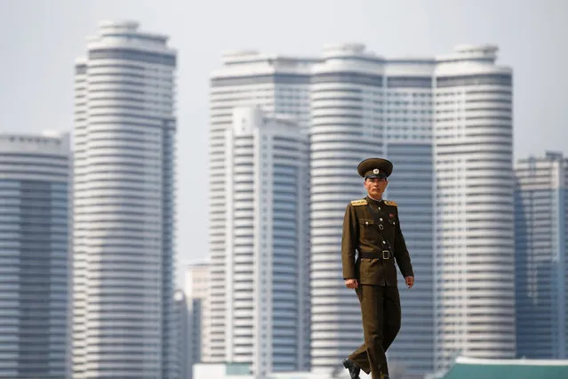 A soldier walks on the bank of the river in central Pyongyang, North Korea April 16, 2017. (Photo by Damir Sagolj/Reuters)