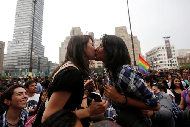 Members of the LGBT community kiss during a Kissathon to celebrate International Day Against Homophobia, outside Bellas Artes museum in Mexico City, Mexico, May 17, 2016. (Photo by Edgard Garrido/Reuters)
