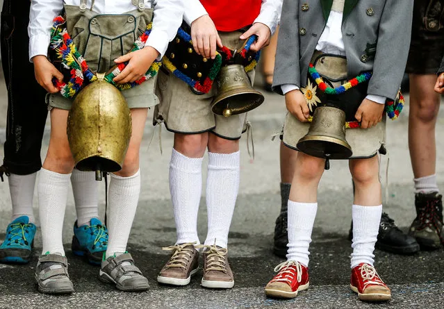 Children in traditional Tyrolean clothes attend a parade at the annual Gauner Festival in Zell am Ziller, Austria May 7, 2017. (Photo by Dominic Ebenbichler/Reuters)
