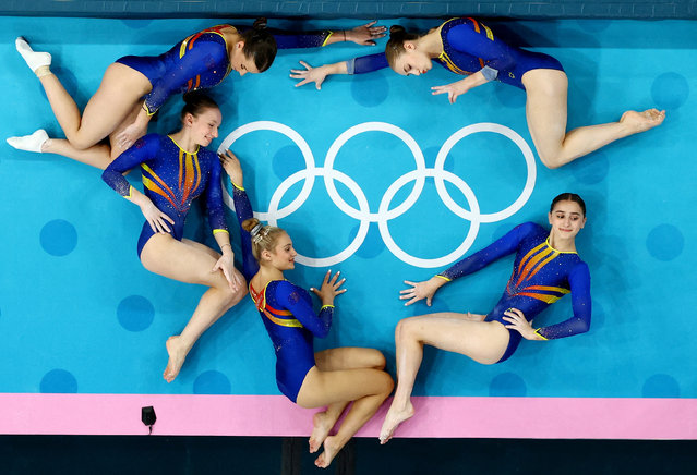 Athletes from Romania pose during training in the artistic gymnastics ahead of the Paris Olympics on July 25, 2024. (Photo by Athit Perawongmetha/Reuters)