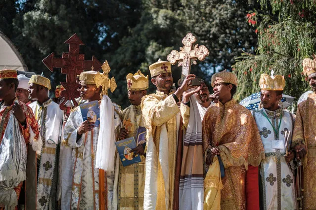 Ethiopian Orthodox deacons stand during the burial ceremony of the late Abune Merkorios, fourth patriarch of the Ethiopian Orthodox church, at the Trinity Cathedral of the city of Addis Ababa, Ethiopia, on March 13, 2022. (Photo by Eduardo Soteras/AFP Photo)