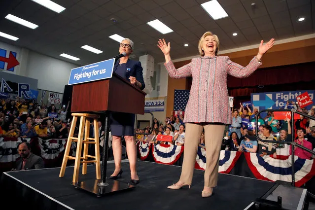 U.S. Democratic presidential candidate Hillary Clinton (R) and actress Jamie Lee Curtis react to the crowd after two male supporters took their tops off at the UFCW Union Local 324 in Buena Park, California, U.S. May 25, 2016. (Photo by Lucy Nicholson/Reuters)