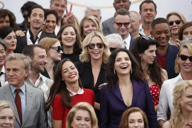 Actors and directors form former Cannes selections pose for photographers during the photo call for the 70th Anniversary of the international film festival, Cannes, southern France, Tuesday, May 23, 2017. (Photo by Thibault Camus/AP Photo)