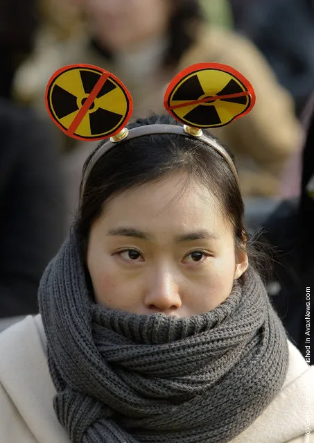 South Korean environmentalists participates in a rally held to commemorate the Fukushima nuclear disaster on the eve of the one year anniversary of Japan's earthquake and tsunami