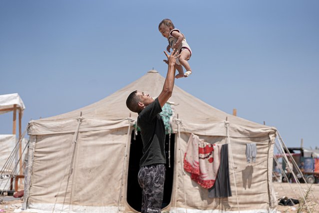 Three-month-old baby Rim is the sole survivor after an Israeli military attack on the home of the Abu Hiyye family in Khan Yunis, Gaza on August 15, 2024. Orphaned by the strike, Rim has been taken in by her aunt, her uncle's wife, as she faces life without her parents. (Photo by Mahmoud Bassam/Anadolu via Getty Images)