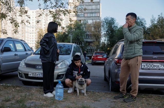 Local residents gather in the courtyard of a damaged multi-storey building following an alleged Ukrainian drone attack, in Ramenskoye in the Moscow region, Russia on September 10, 2024. (Photo by Maxim Shemetov/Reuters)