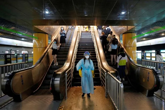 A worker in a protective suit cleans the floor at a subway station, after the lockdown placed to curb the coronavirus disease (COVID-19) outbreak was lifted in Shanghai, China on June 2, 2022. (Photo by Aly Song/Reuters)