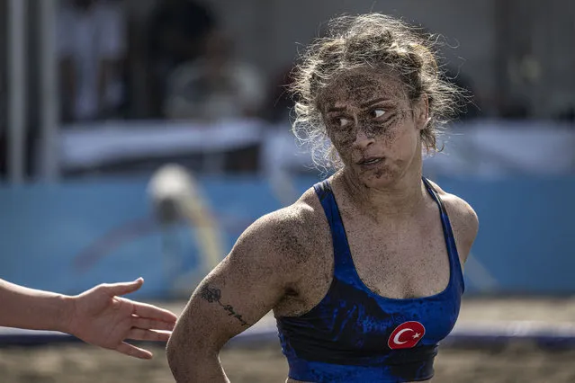 In this handout image provided by United World Wrestling, Emine Cataloglu of Turkey reacts during her match against Stefania Claudia Priceputu (not in photo) of Romania during the final day of the first stop of the UWW Beach Wrestling World Series on May 29, 2022 in Sarigerme, Turkey. (Photo by Dean Treml/UWW via Getty Images)