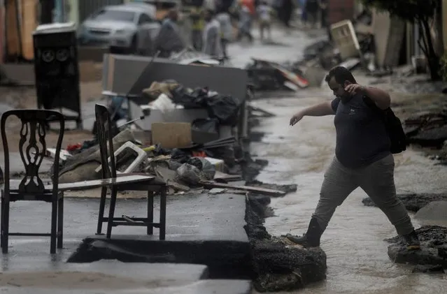A resident walks at a damaged area in Realengo neighborhood after heavy rains in Rio de Janeiro, Brazil on March 2, 2020. (Photo by Ricardo Moraes/Reuters)
