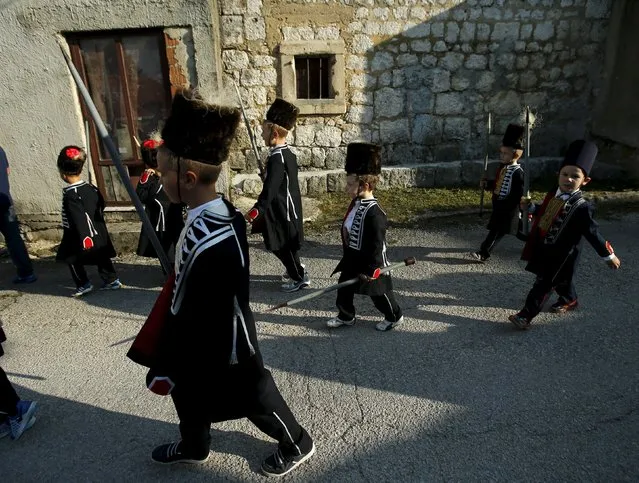 Children are seen before the Children's Alka competition in Vuckovici village, Croatia, August 23, 2015. (Photo by Antonio Bronic/Reuters)