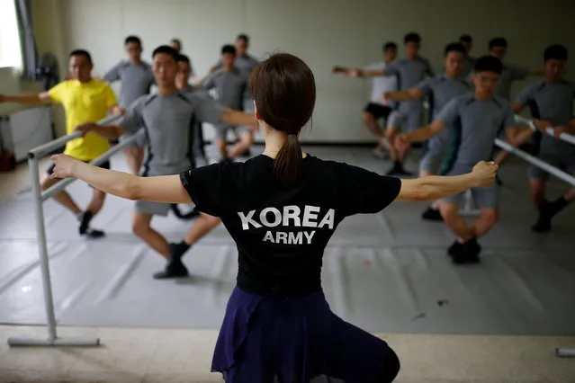 South Korean soldiers take part in a ballet class at a military base near the demilitarized zone separating the two Koreas in Paju, South Korea, July 13, 2016. Once a week, a group of South Korean soldiers near the Demilitarized Zone (DMZ) that divides the Korean peninsula trade army boots for ballet shoes in a class intended to ease the stress of guarding the world’s most heavily fortified border. (Photo by Kim Hong-Ji/Reuters)