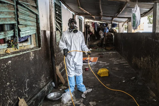 In this Wednesday, April 1, 2020, photo, a municipal worker sprays disinfectant in a Quran school to help curb the spread of the new coronavirus in Dakar, Senegal. (Photo by Sylvain Cherkaoui/AP Photo)