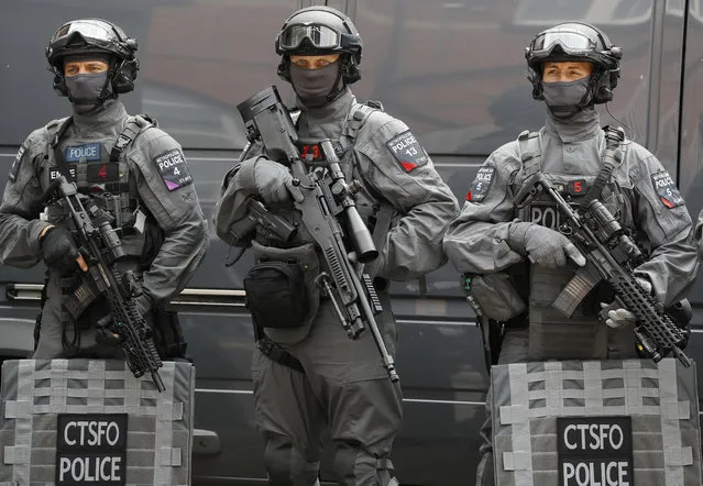 Police counter terrorism officers pose during a media opportunity in London, Wednesday, August 3, 2016. London's police force is putting more armed officers on the streets 'to protect against the threat of terrorism.'' The increase in the number of officers follows attacks in France, Belgium and Germany. (Photo by Kirsty Wigglesworth/AP Photo)