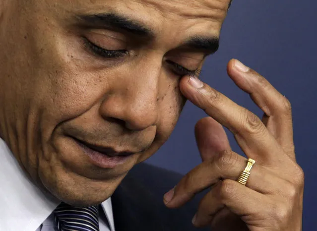 U.S. President Barack Obama wipes a tear as he speaks about the shooting at Sandy Hook Elementary School in Newtown, Conn., during a press briefing in Washington D.C., December 14, 2012. (Photo by Yuri  Gripas/Reuters)