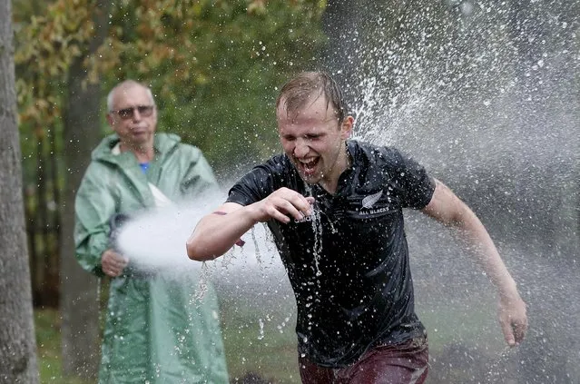 A man runs as he takes part in an extreme run competition in Zhodino, east of Minsk, September 26, 2015. (Photo by Vasily Fedosenko/Reuters)