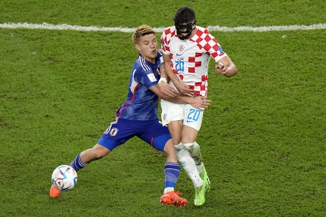 Japan's Ritsu Doan, left, is challenged by Croatia's Josko Gvardiol during the World Cup round of 16 soccer match between Japan and Croatia at the Al Janoub Stadium in Al Wakrah, Qatar, Monday, December 5, 2022. (Photo by Luca Bruno/AP Photo)