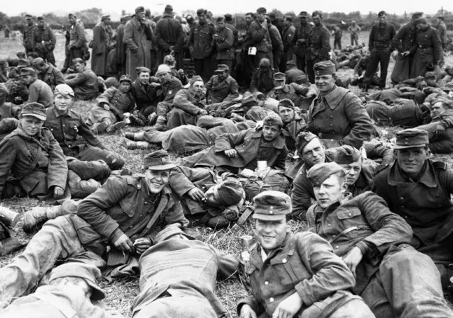 A large group of German prisoners on a beachhead in Normandy, France on June 13, 1944, awaiting transportation to England. (Photo by AP Photo)