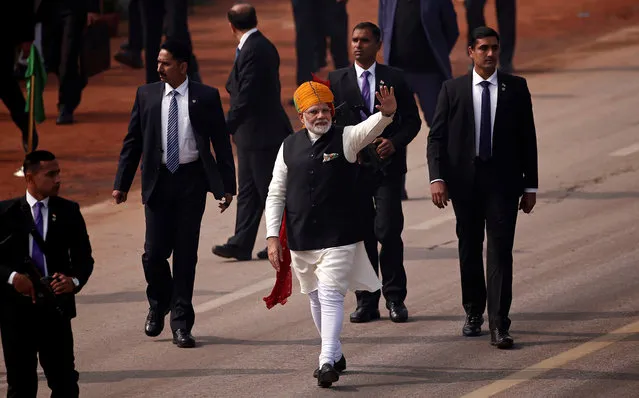 Prime Minister Narendra Modi waves towards the crowd as he leaves after attending the Republic Day parade in New Delhi, India January 26, 2018. (Photo by Adnan Abidi/Reuters)