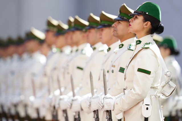 Honor guards stand as Chilean President Gabriel Boric welcomes Greece's President Katerina Sakellaropoulou to La Moneda presidential palace in Santiago, Chile, April 24, 2024. (Photo by Esteban Felix/AP Photo)