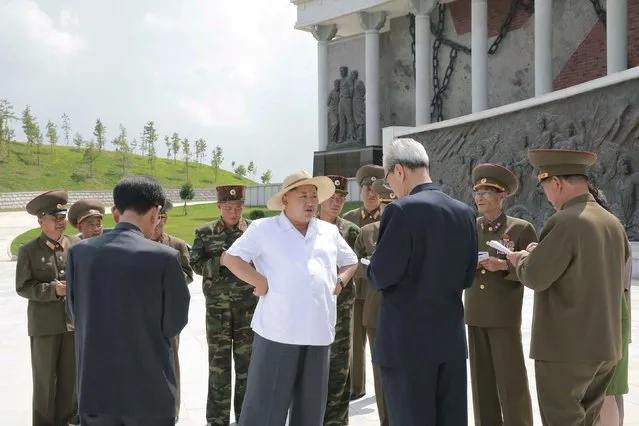 North Korean leader Kim Jong Un (C) gives field guidance to the newly built Sinchon Museum in this undated photo released by North Korea's Korean Central News Agency (KCNA) on July 23, 2015. (Photo by Reuters/KCNA)