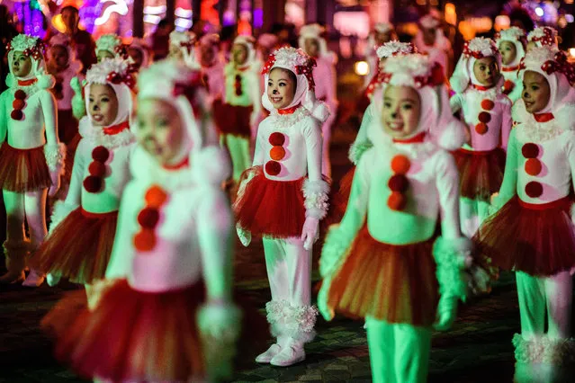 Performers take part in a street parade to mark the Lunar New Year celebrations for the Year of the Dog in Hong Kong on February 16, 2018. (Photo by Anthony Wallace/AFP Photo)