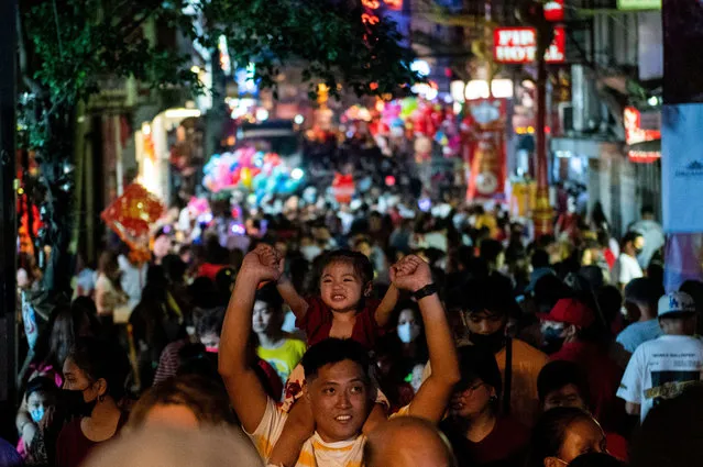 People visit Manila's Chinatown during Chinese Lunar New Year, in Manila, Philippines on January 22, 2023. (Photo by Lisa Marie David/Reuters)