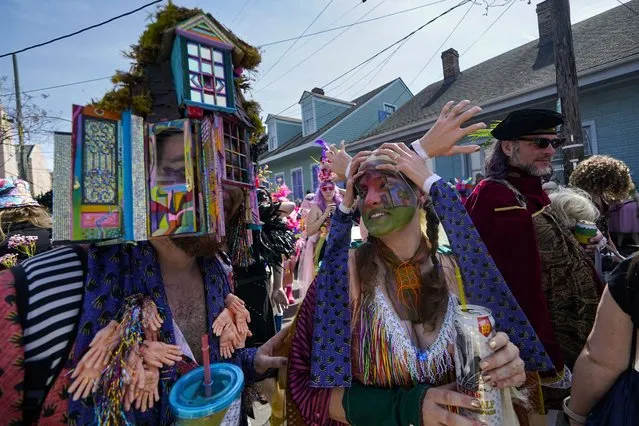 Revelers participate in the La Socete de Saint Anne Parade on Mardi Gras Day in New Orleans, Tuesday, February 21, 2023. (Photo by Gerald Herbert/AP Photo)