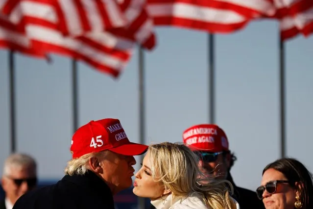 U.S. President Donald Trump kisses his daughter Ivanka at the end of a campaign rally at Dubuque Regional Airport in Dubuque, Iowa, U.S., November 1, 2020. (Photo by Carlos Barria/Reuters)
