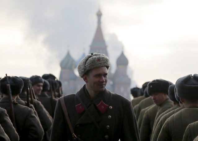 Russian servicemen dressed in historical uniforms take part in a military parade on the Red Square with St. Basil's Cathedral seen in the background in central Moscow, Russia, November 7, 2015. (Photo by Maxim Shemetov/Reuters)