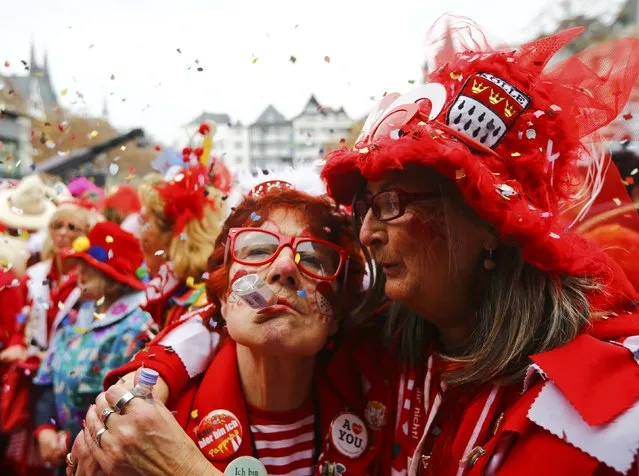 Carnival revellers celebrate the start of the carnival season in Cologne November 11, 2015. (Photo by Wolfgang Rattay/Reuters)