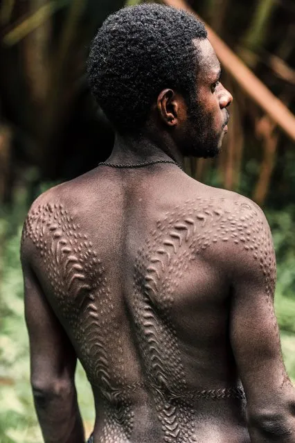 One of the tribes pictured are the Kangunaman, who scar their backs to resemble reptile scales. (Photo by Trevor Cole/Media Drum World)