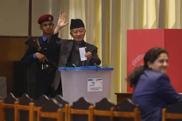 Presidential candidate Subhas Nembang of the Communist Party of Nepal (Unified Marxist-Leninist) waves before casting his vote for Nepal's new president in Kathmandu, Nepal, Thursday, March 9, 2023. Nepal's parliament members lined up Thursday to elect a new president the third one since the Himalayan nation abolished a centuries-old monarchy and the country was turned into a republic. The election for the president has fuelled feuds among the main political parties and triggered political uncertainty. (Photo by Bikram Ra/AP Photoi)