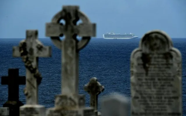 The Ruby Princess cruise ship anchored at sea is seen from a cemetery in Sydney, Australia, 01 April 2020. According to media reports, a number of passengers from the Ruby Princess have died in recent days due to coronavirus and a number of crew members have been taken off the ship and hospitalized. (Photo by Joel Carrett/EPA/EFE/Rex Features/Shutterstock)