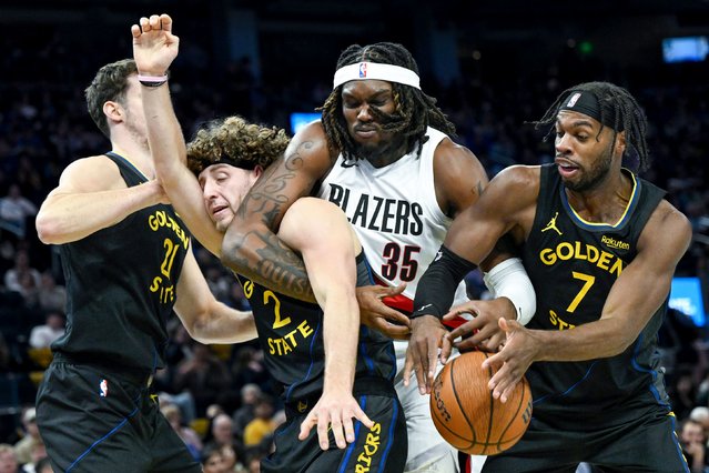The Portland Trail Blazers’ Robert Williams III battles several Golden State Warriors for a rebound during an NBA game in San Francisco on Friday, November 21, 2025. (Photo by Eakin Howard/Getty Images)
