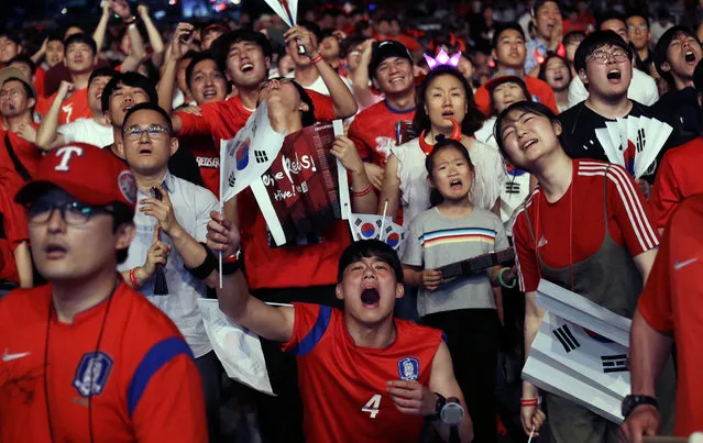 In this Monday, June 18, 2018, file photo, South Korean soccer fans react as they watch a live broadcasting of the Group F World Cup soccer match between South Korea and Sweden at a public viewing venue in Seoul, South Korea. (Photo by Ahn Young-joon/AP Photo)